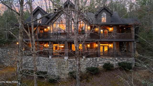 view of back of house at dusk