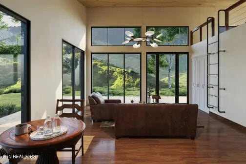 sunroom / solarium featuring an inviting chandelier