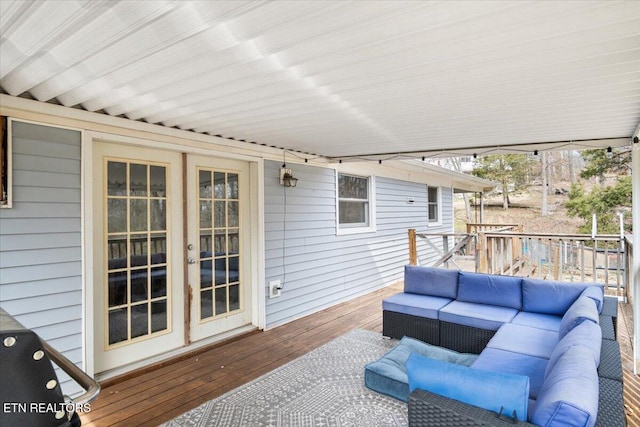 deck with outdoor lounge area and french doors