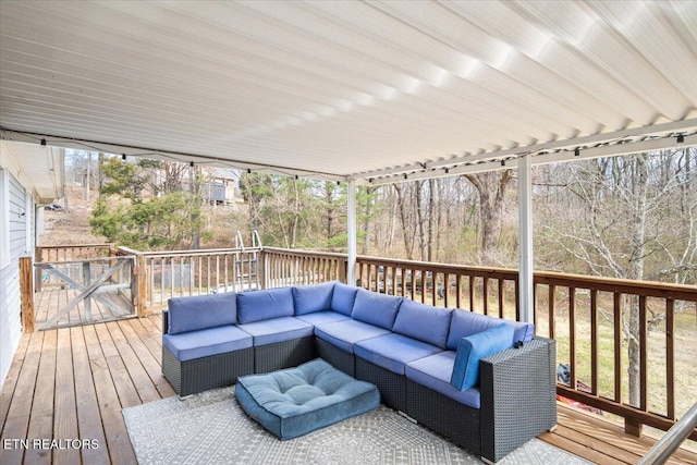 wooden deck featuring an outdoor hangout area