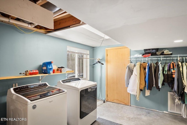 laundry area with laundry area, visible vents, and separate washer and dryer