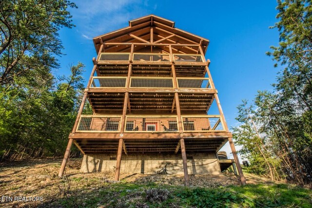 back of house featuring a deck