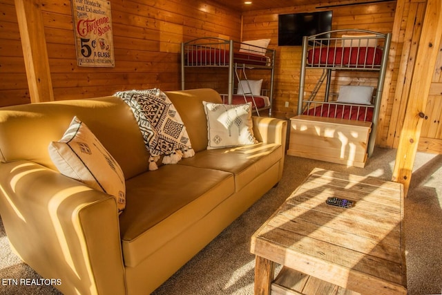 carpeted bedroom with wooden walls