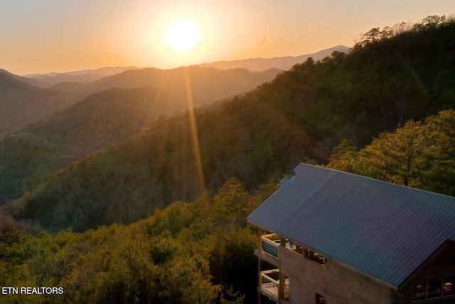 property view of mountains with a wooded view