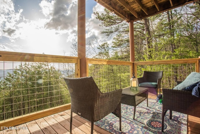 wooden terrace featuring outdoor lounge area