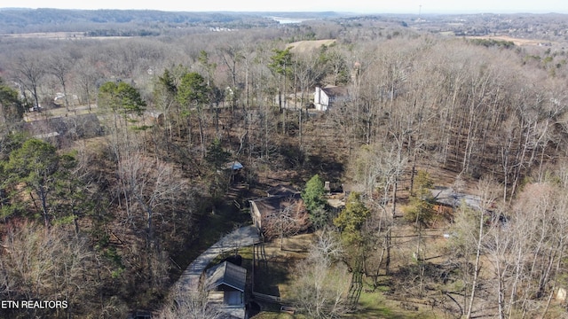 aerial view with a wooded view