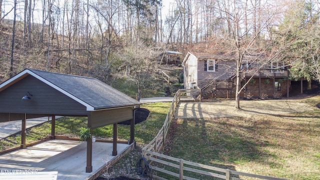 view of yard with stairway and fence