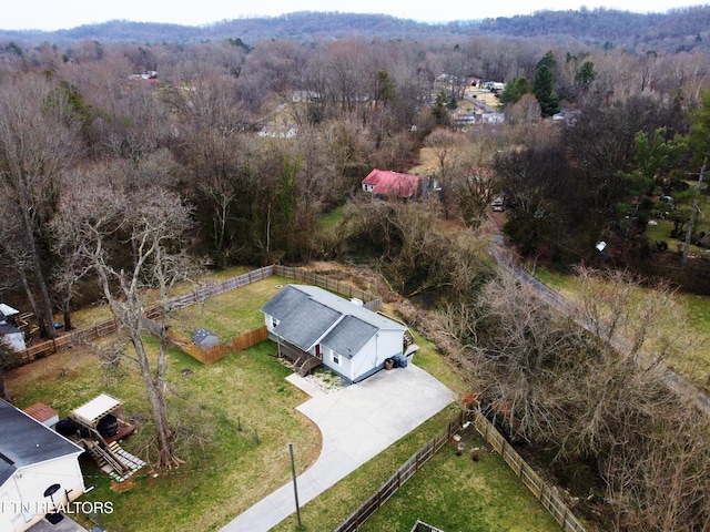 drone / aerial view featuring a forest view