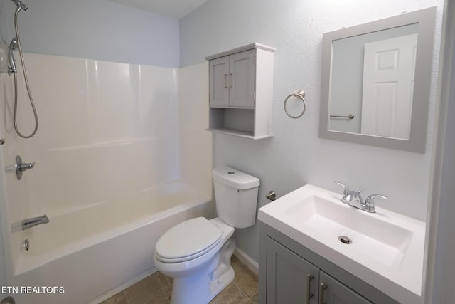 bathroom featuring toilet, tile patterned flooring,  shower combination, and vanity