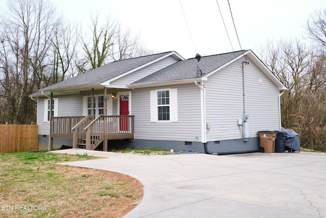 single story home with a shingled roof, crawl space, and fence