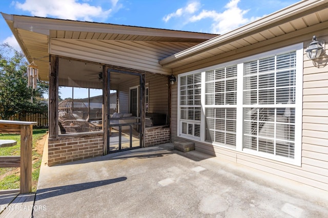 view of patio with a sunroom