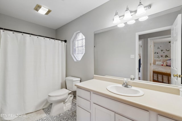 full bath with tile patterned floors, toilet, and vanity