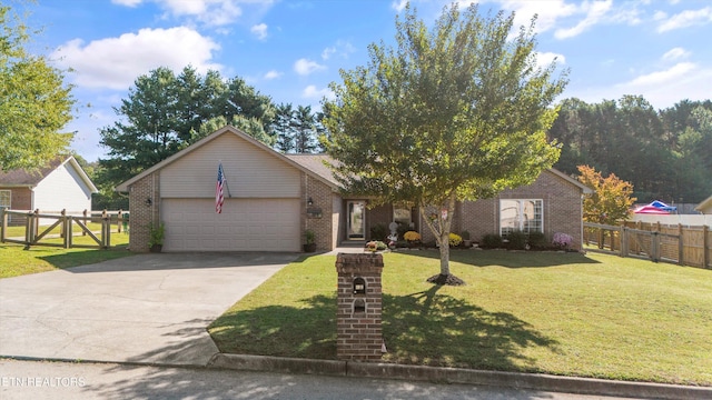 view of front of property with a front lawn, fence, concrete driveway, a garage, and brick siding