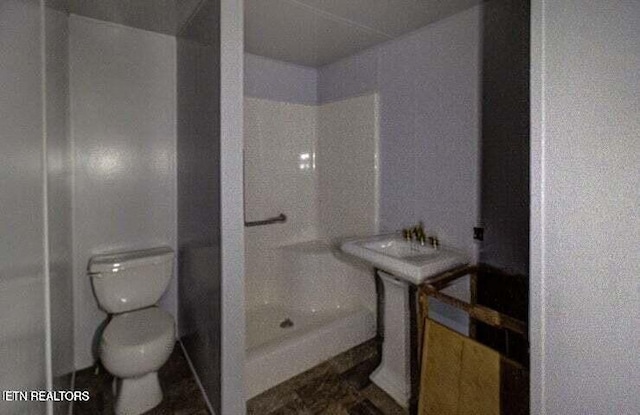 full bathroom with walk in shower and toilet