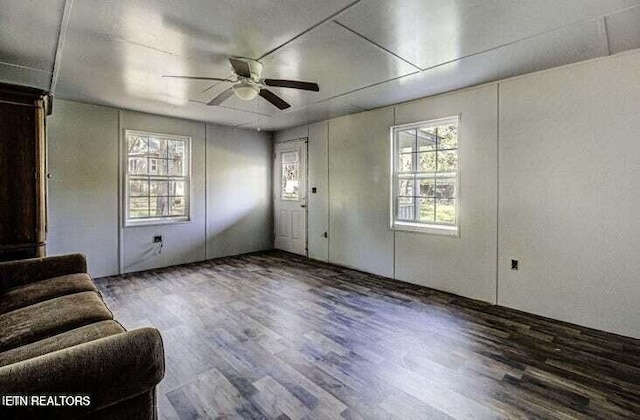 unfurnished living room with ceiling fan and wood finished floors