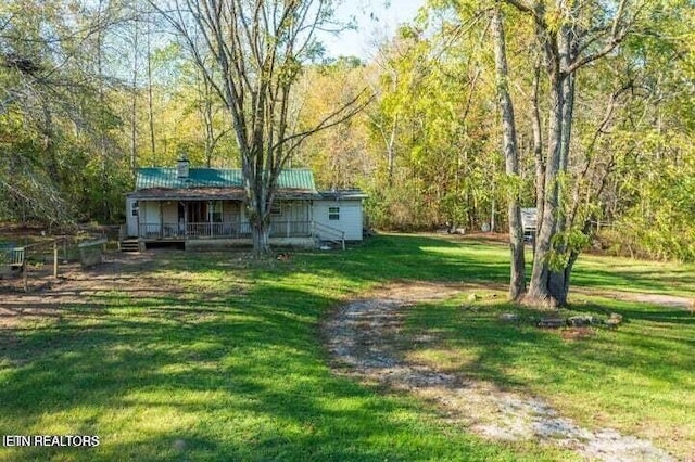 view of yard with a forest view