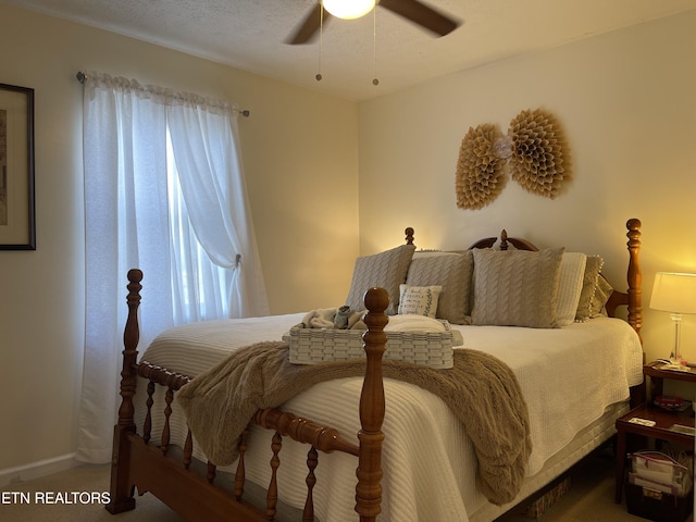 bedroom featuring multiple windows and a ceiling fan