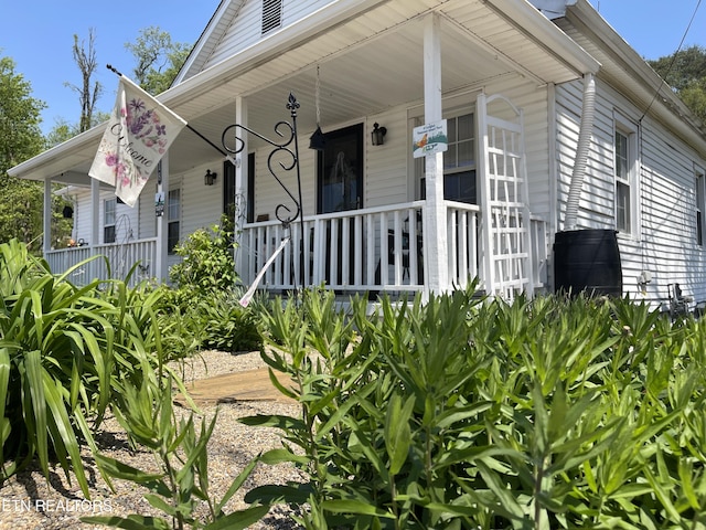 view of side of home featuring a porch