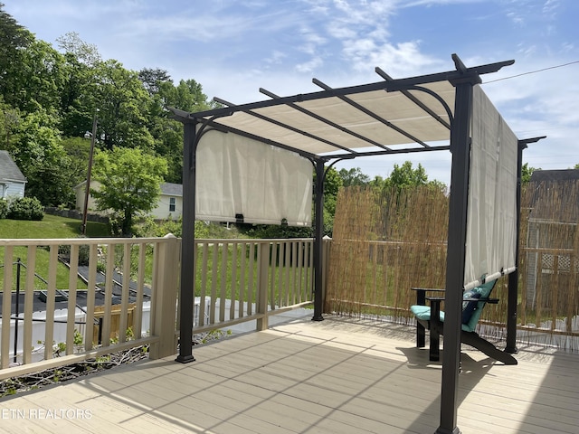wooden deck featuring a pergola