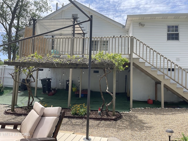 exterior space with a deck and stairway