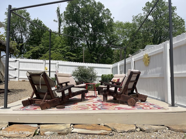 deck with a fenced backyard