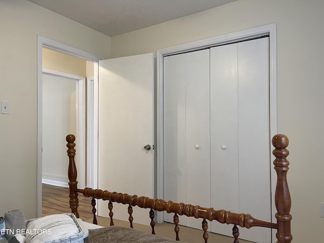 bedroom with a closet and wood finished floors