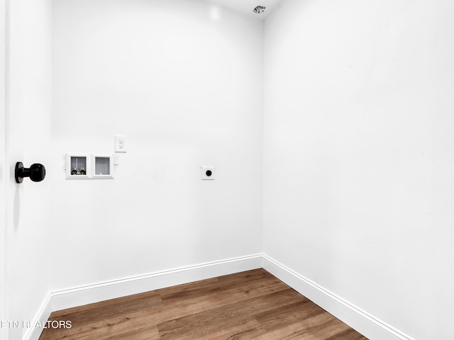 laundry room featuring laundry area, baseboards, wood finished floors, hookup for a washing machine, and hookup for an electric dryer