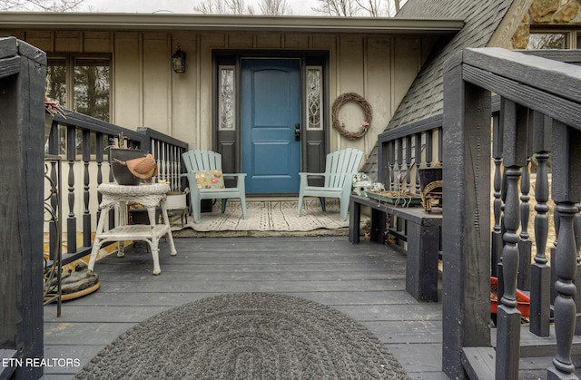 view of exterior entry with covered porch