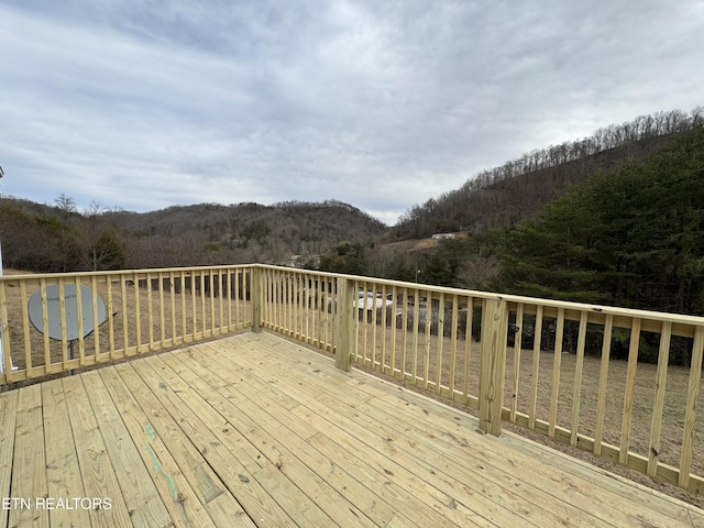 deck featuring a view of trees