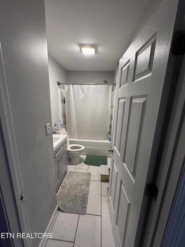 full bath featuring tile patterned flooring, toilet, vanity, shower / bath combo, and a textured ceiling