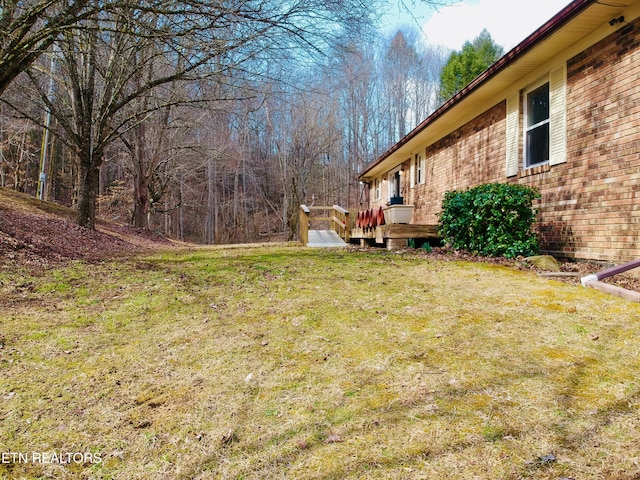 view of yard featuring a wooden deck