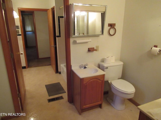 bathroom with toilet, visible vents, and vanity