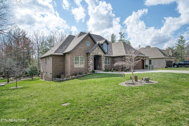 12 Inwood Dr, Fairfield Glade, TN 38558 - view of front of property with a garage, a front yard, brick siding, and driveway