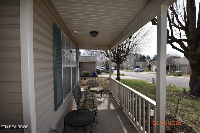 balcony with a residential view and covered porch