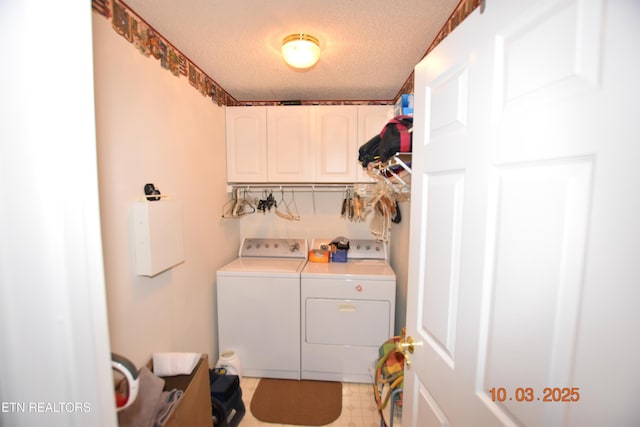 washroom with cabinet space, a textured ceiling, light floors, and washing machine and dryer