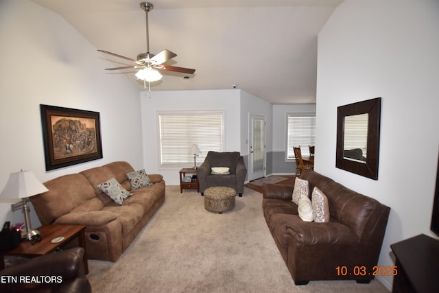 carpeted living area featuring high vaulted ceiling and ceiling fan