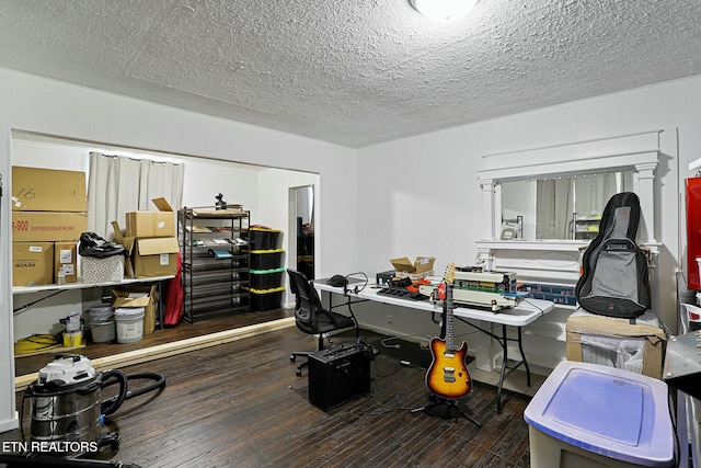 home office featuring a textured ceiling and hardwood / wood-style flooring