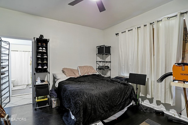 bedroom featuring a ceiling fan and wood finished floors