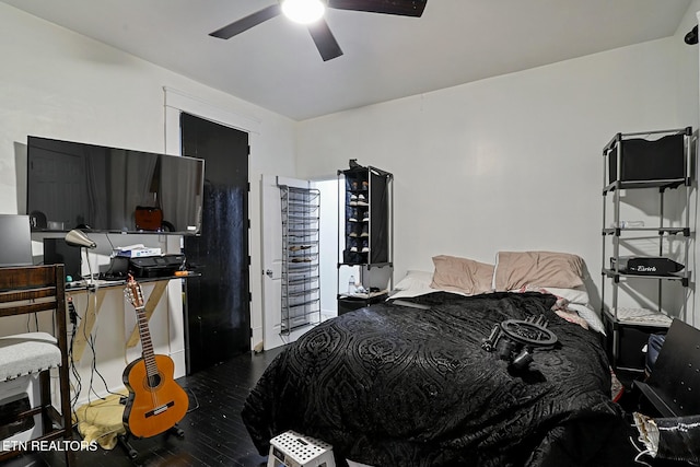 bedroom with ceiling fan and wood finished floors