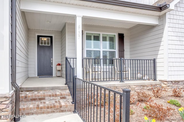 entrance to property with covered porch