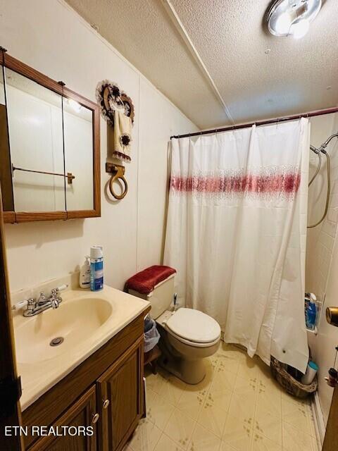 4637 Nails Creek Rd, Rockford, TN 37853 - bathroom with tile patterned floors, toilet, vanity, and a textured ceiling