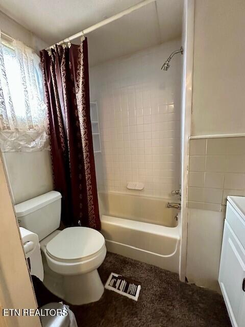 4637 Nails Creek Rd, Rockford, TN 37853 - full bath featuring vanity, visible vents, shower / tub combo, tile walls, and toilet