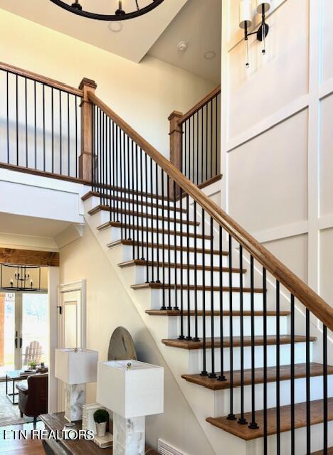 staircase with a high ceiling