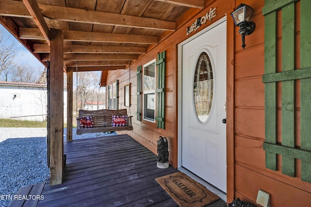 entrance to property featuring a porch