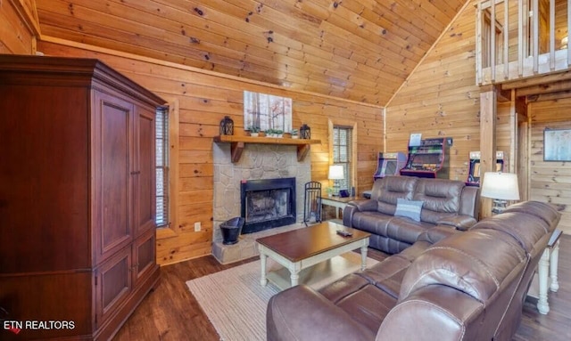 living area featuring wooden walls, dark wood finished floors, a stone fireplace, wooden ceiling, and high vaulted ceiling