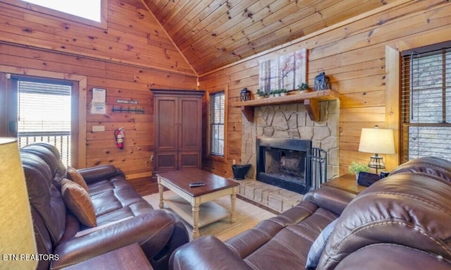 living room featuring wooden ceiling, wood walls, a fireplace, and vaulted ceiling