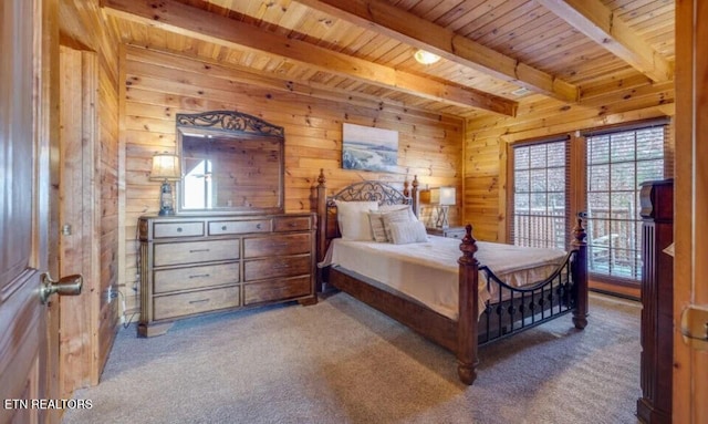 bedroom with beamed ceiling, wooden ceiling, wooden walls, and carpet floors