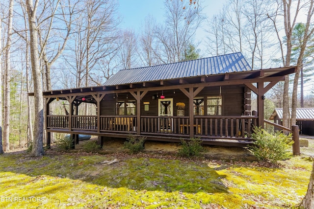 view of front of house with covered porch and metal roof