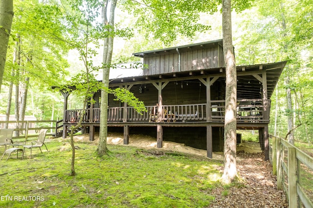 784 Wilderness Trl, Oneida, TN 37841 - rear view of property with board and batten siding and a wooden deck