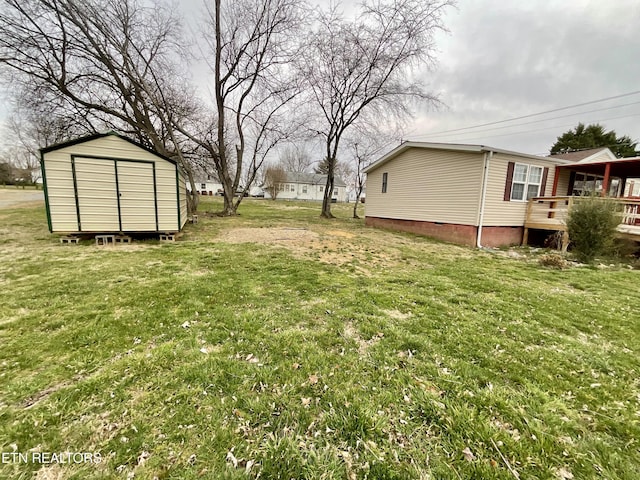 view of yard featuring an outbuilding and a storage shed